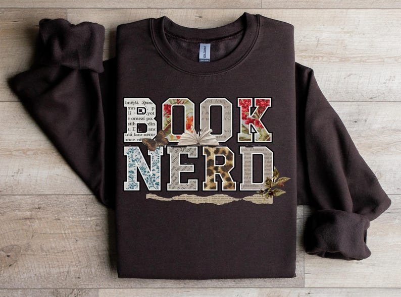 Brown sweatshirt with "BOOK NERD" text in floral and animal print.