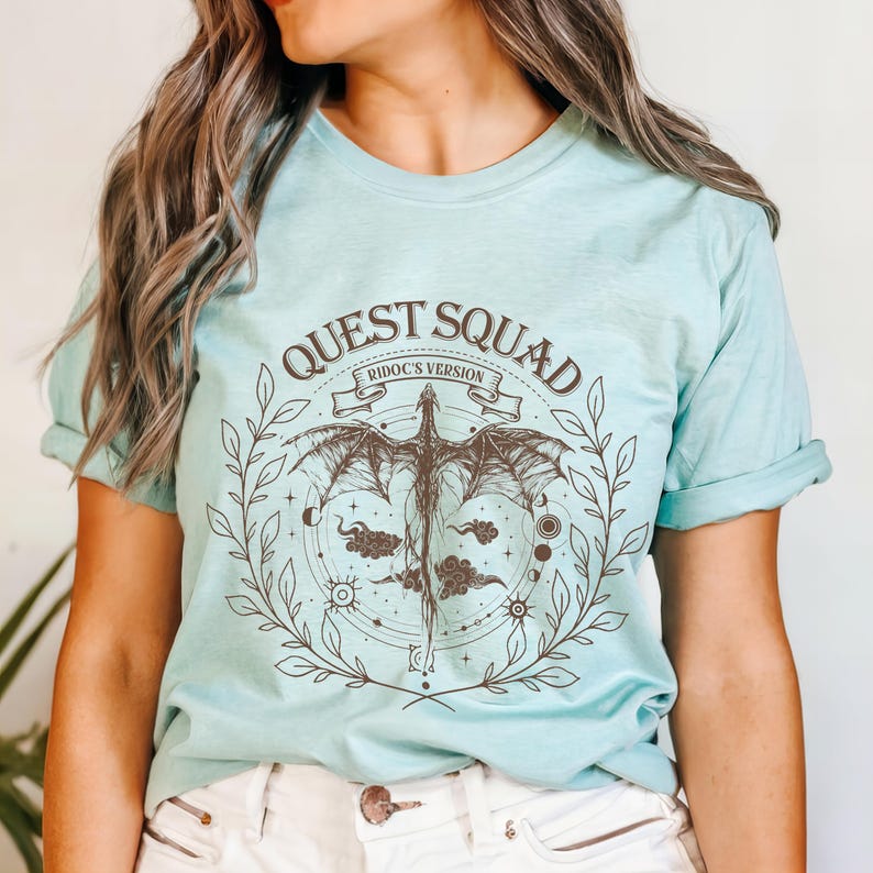 a woman wearing a t - shirt that says quest squad