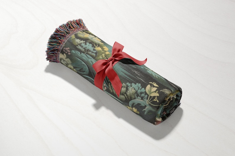 a rolled up piece of fabric with a red ribbon