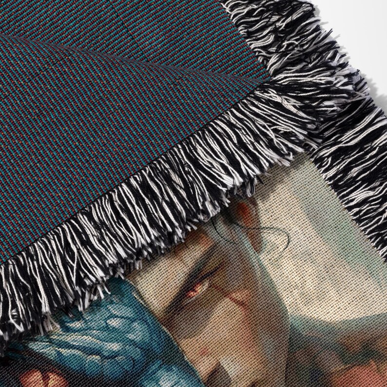 a close up of a scarf with a picture of a man on it