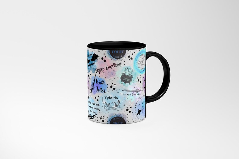 a black and white coffee mug with a pattern on it