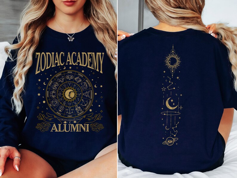 a woman sitting on a bed wearing a zodiac t - shirt