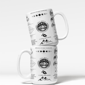 two coffee mugs stacked on top of each other
