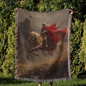 a man holding a large tapestry with a painting of a man on a horse