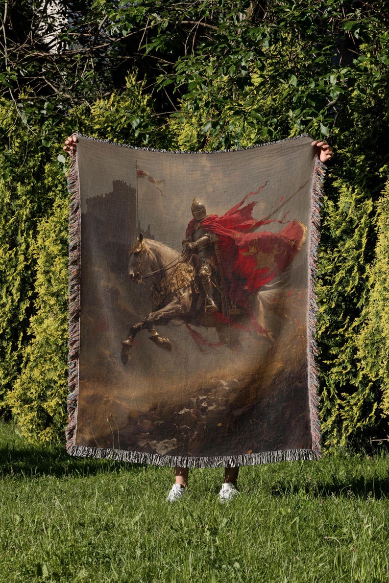 a man holding a large tapestry with a painting of a man on a horse