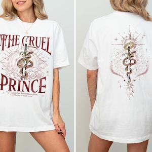 a woman wearing a white t - shirt that says the cruel prince