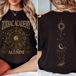 a woman sitting on a bed wearing a zodiac t - shirt