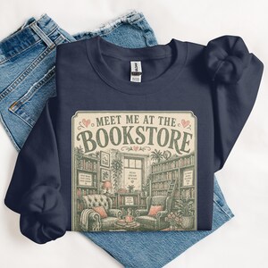 Dark navy sweatshirt with vintage bookstore graphic and text.