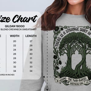 Gildan 18000 sweatshirt size chart with tree graphic and text.