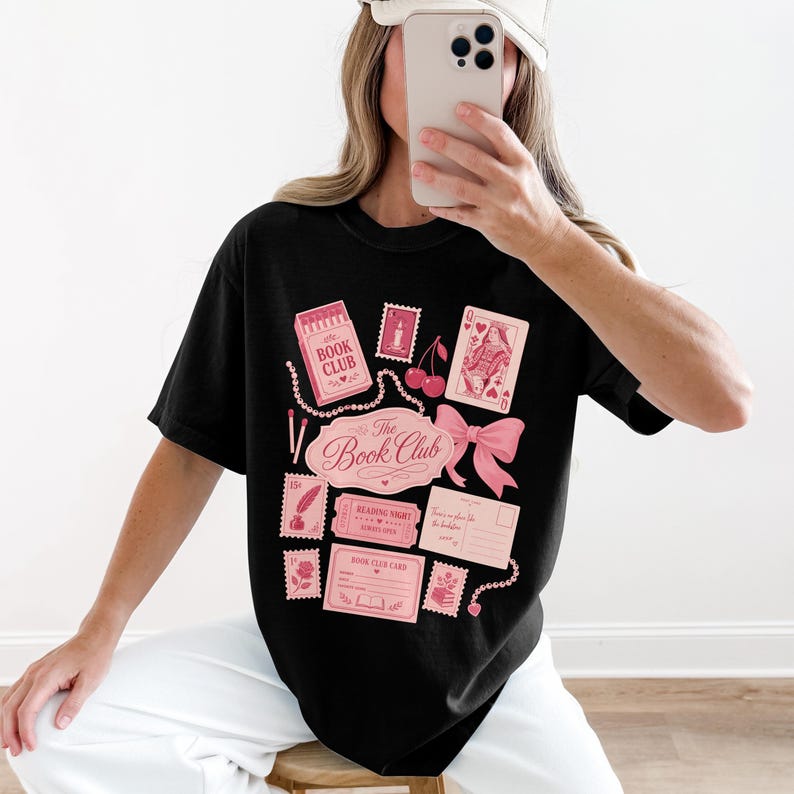 Black t-shirt with pink "Book Club" graphics and postage stamps.