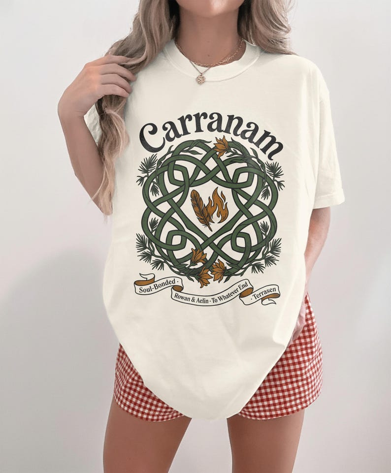 Cream t-shirt with a Celtic knot design featuring "Carranam" in leafy script.
