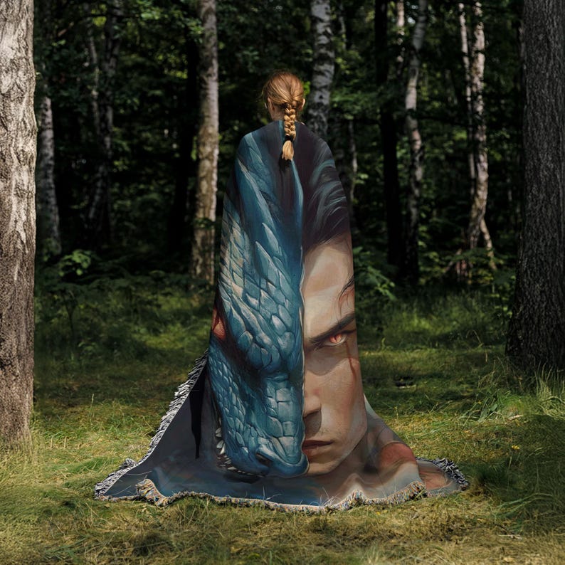 a woman wrapped in a blanket in the woods