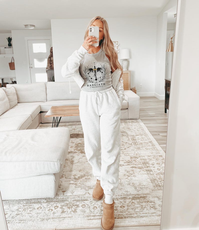 a woman taking a selfie in a living room