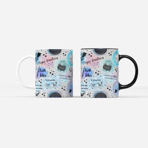 a pair of coffee mugs sitting on top of each other