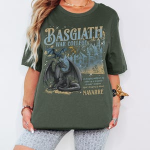 a woman wearing a tshirt with a picture of a dragon on it
