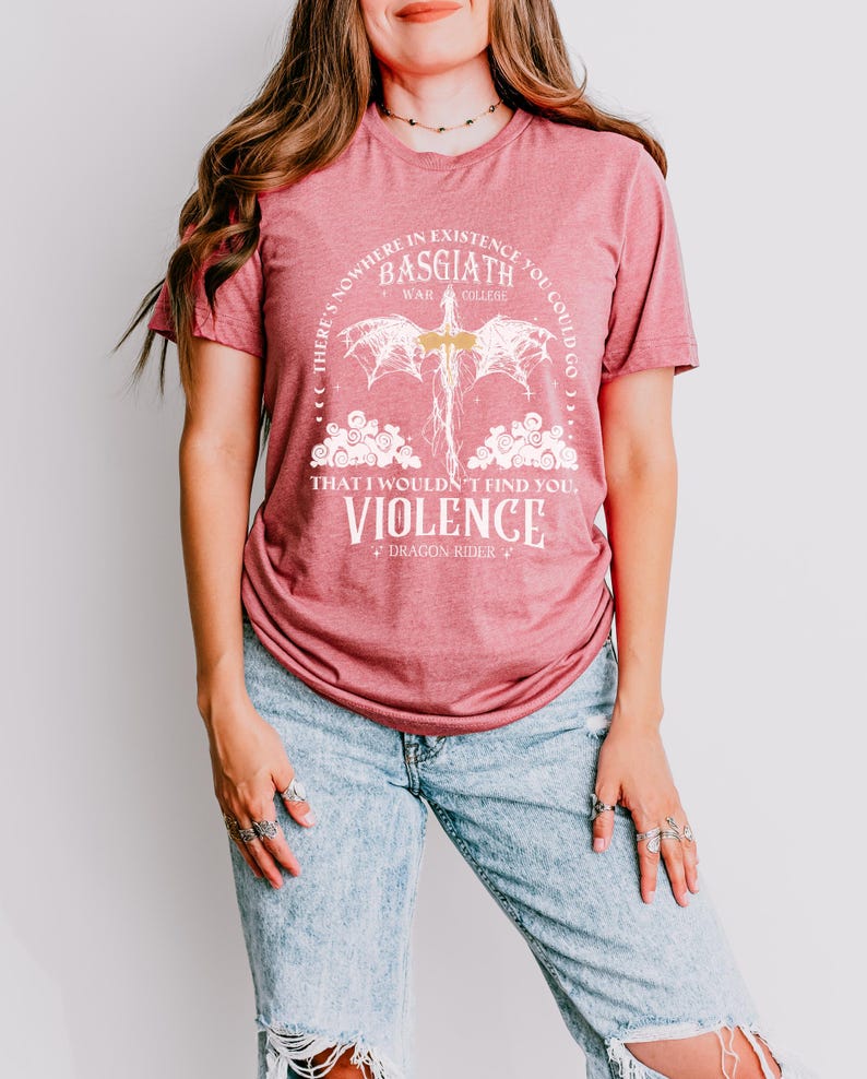 a woman wearing a red shirt and ripped jeans