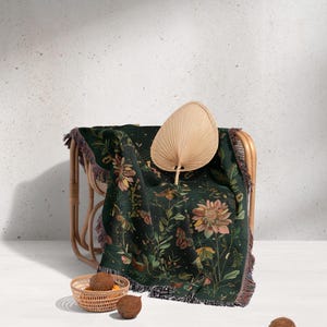a chair with a blanket and a basket on it