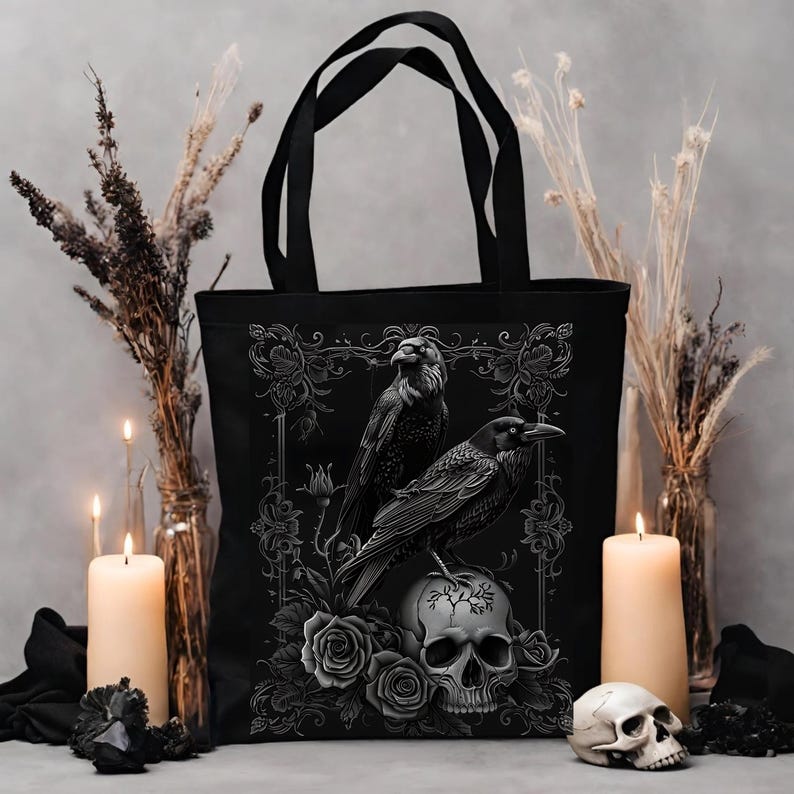 a black tote bag with a crow on it
