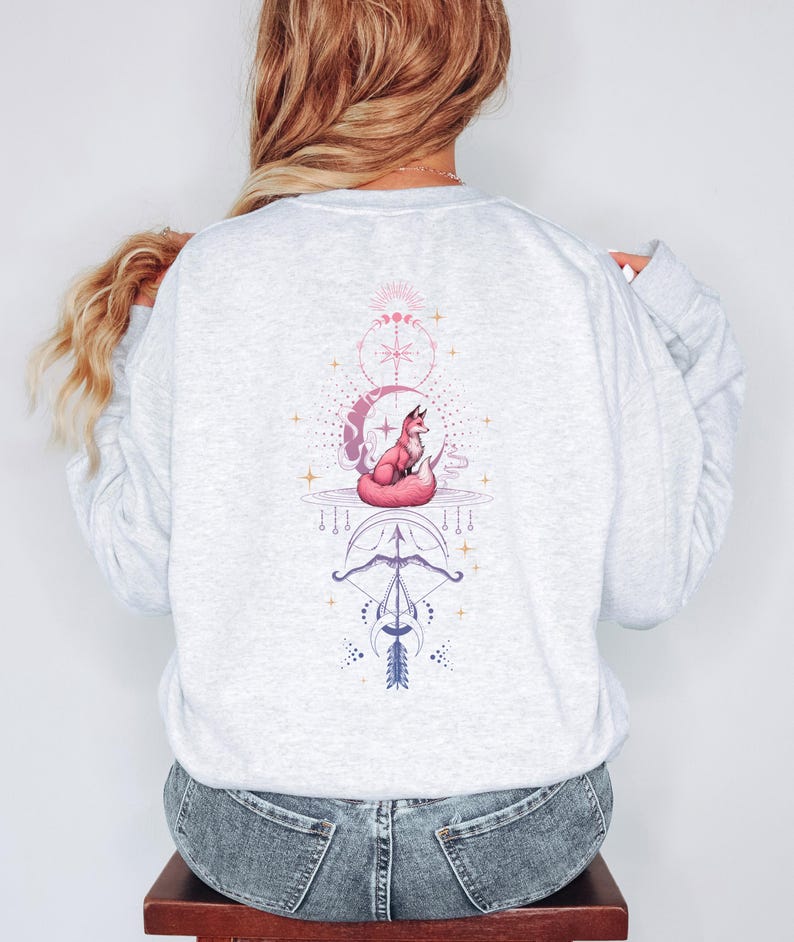 the back of a woman's sweatshirt with a picture of a cat on it