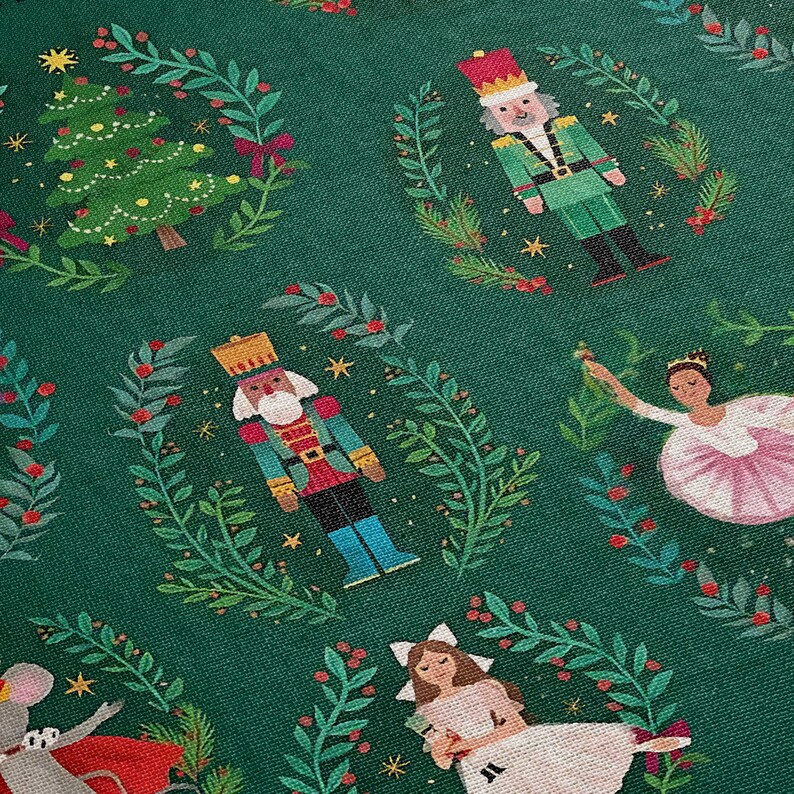 a green christmas fabric with nutcrackers and nutcrackers