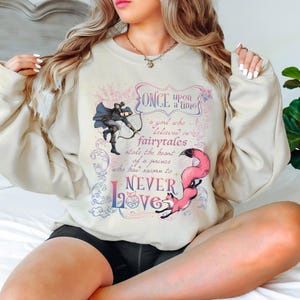 a woman sitting on a bed with her legs crossed