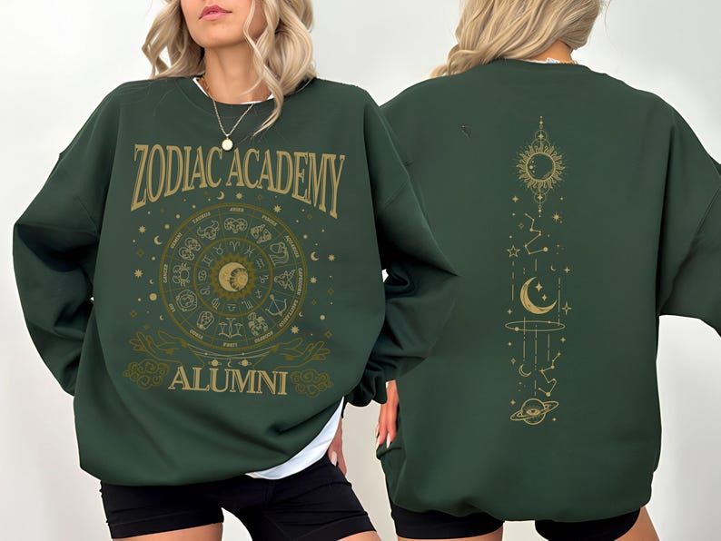 a woman is wearing a green zodiac sweatshirt
