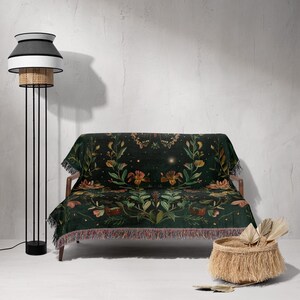 a living room with a couch and a lamp