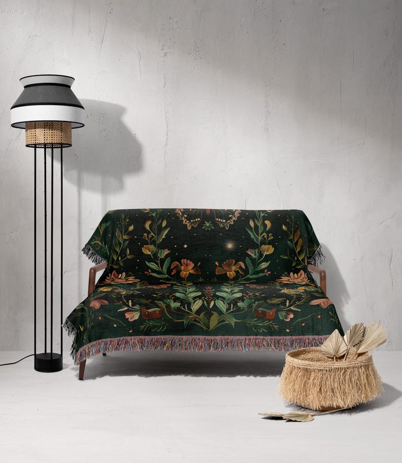 a living room with a couch and a lamp