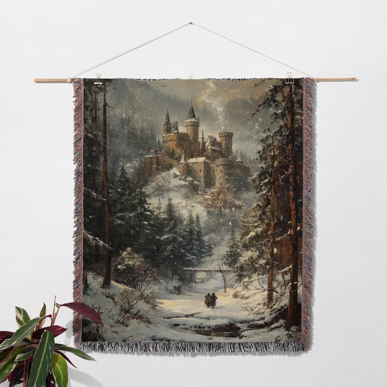 a tapestry hanging on a wall with a painting of a castle in the background