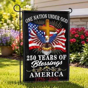 May include: Black garden flag with patriotic design. Features an American flag, cross, and eagle with text "One Nation Under God" and "250 Years of Blessings America 1776-2026". Decorative outdoor flag.