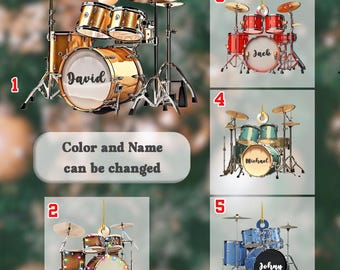 May include: Five different drum set Christmas ornaments with personalized names. The ornaments are gold, red, green, brown, and blue. The names on the ornaments are David, Elvis, Jack, Michael, and Johnny.