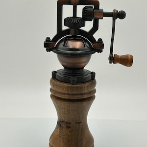 Antique pepper mill made of walnut
