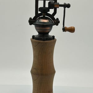 Antique pepper mill made of walnut