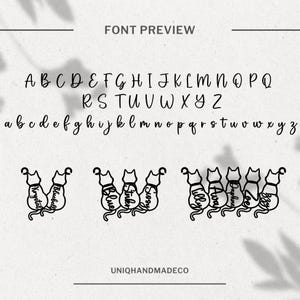May include: Font preview image showing the alphabet in uppercase and lowercase letters. The font is a handwritten style. Below the alphabet, there are seven black and white illustrations of cats sitting in a row. Each cat has a name written on its back: Krystal, Bluebell, Stinker, Sissy, Tilly, Ava, Daphne, Zoe, and Lily.