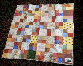 Handmade Winnie the Pooh themed child's quilted blanket in autumn earth tones