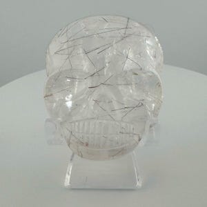 Red Rutile in GEM Quartz Magical Child Palm Skull carved by Leandro de Souza