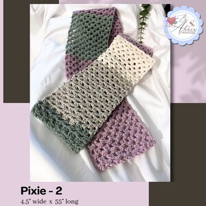 May include: A crocheted scarf in shades of green, beige, and purple. The scarf is 4.5 inches wide and 55 inches long. "Pixie - 2" is written below the scarf.