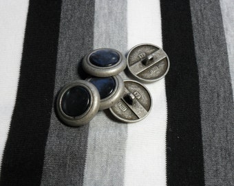 Metal and plastic button. 1 button.
