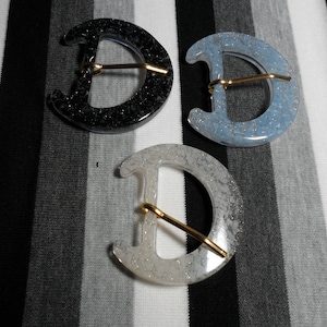 Glitter Resin Belt Buckle. Blue, white, or black. 1 buckle.