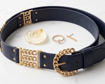 Cinturón vintage de cuero azul oscuro con hebilla de cadena dorada, estilo glamuroso de los 80
