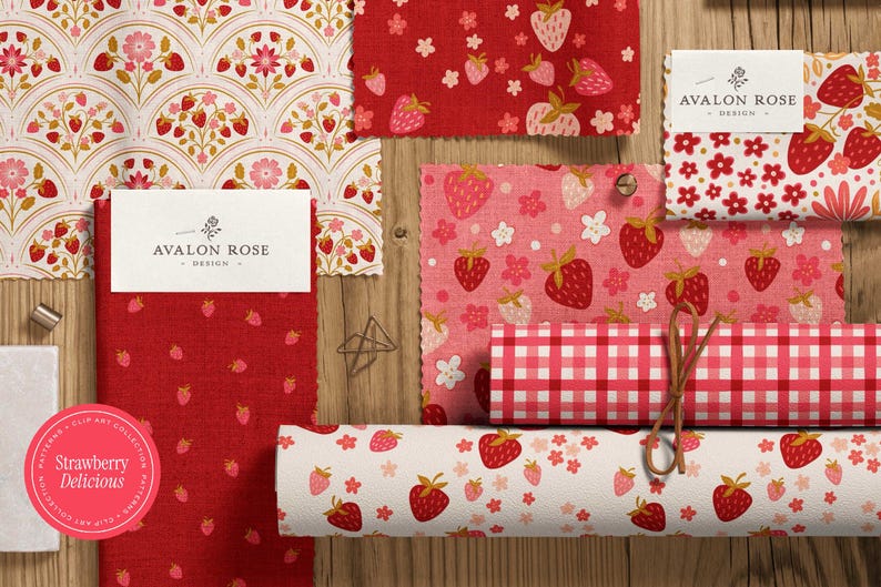 May include: A collection of fabric swatches with strawberry patterns in red, pink, and white. Designs include strawberries, flowers, and gingham. The Avalon Rose Design logo is visible on several tags. A circular sticker reads "Strawberry Delicious."