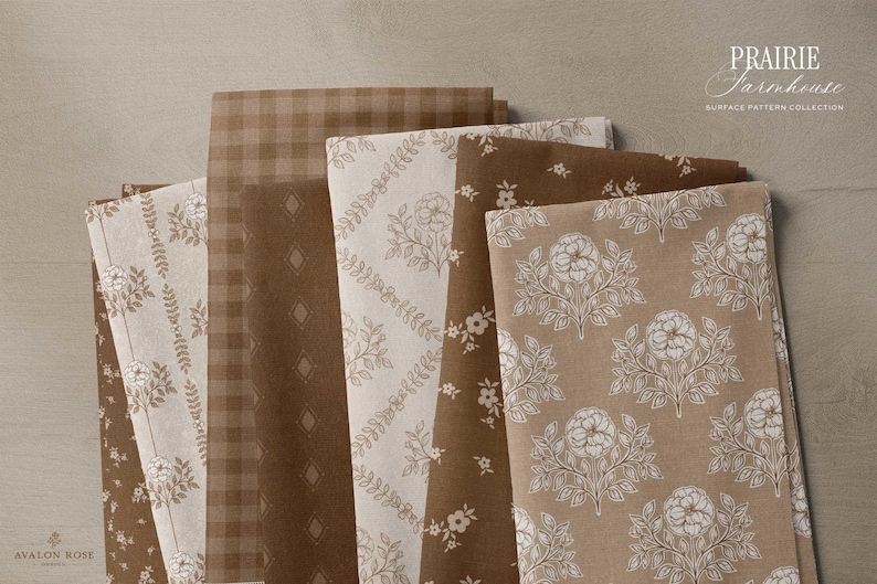 Bolts of fabric featuring a collection of brown and beige hand drawn floral patterns