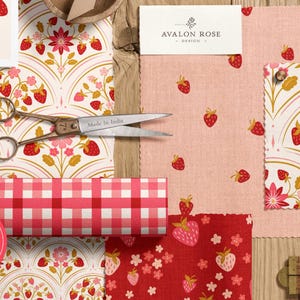 May include: A collection of fabric swatches and paper with strawberry patterns, scissors, and a ruler. The fabrics include pink and red strawberry prints, a red and white gingham pattern, and a floral design. A label reads "Avalon Rose Design."