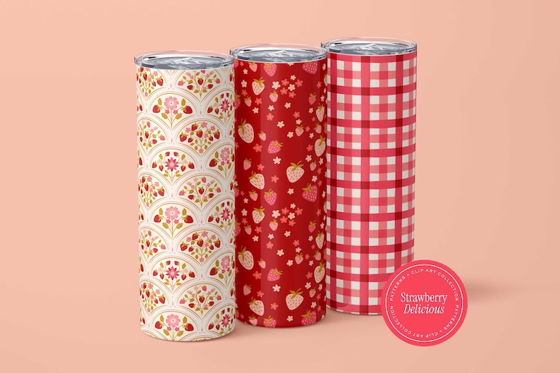 May include: Three insulated tumblers with strawberry designs. One has a white and red fan pattern, another a red strawberry pattern, and the third a red and white gingham pattern. A pink sticker reads "Strawberry Delicious."