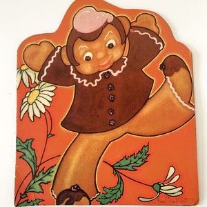 May include: A gingerbread person with a pink hat and brown dress is standing on one leg with the other leg bent behind them. The gingerbread person is surrounded by white daisies with green stems and leaves on an orange background. The image is signed "Vera Maxwell Pat."