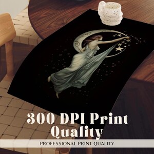 May include: A rectangular black placemat featuring a central illustration of a figure in a flowing gown reaching toward a crescent moon and stars. The design includes a white speckled mug placed on the upper right corner of the mat surface.