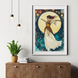 May include: A framed wall art print featuring a figure in a flowing white and gold dress standing before a large, glowing yellow moon. The background is a deep teal with decorative floral elements and circular patterns in shades of orange and gold.