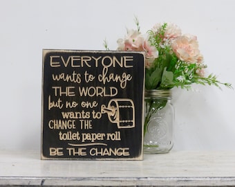 everyone wants to change the world but no one wants to change the toilet paper roll wood sign