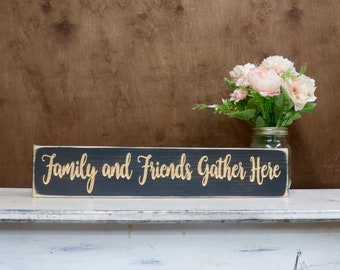 family and friends gather here lightly distressed wood sign