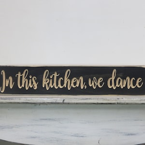 in this kitchen we dance lightly distressed wood sign